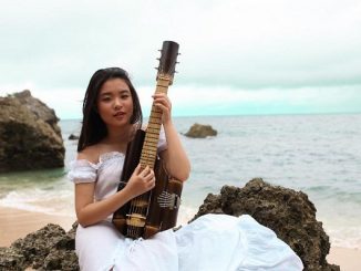Kyla Christie, Recipient of The Diana Award 2020, with her own created bamboo music instrument named “Esthesque” which means : beauty beyond the world